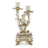 SMALL TWO-BRANCHED CANDLESTICK IN CERAMICS, LATE 19TH CENTURY entirely in white enamel and gold,