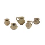 FIVE MINIATURE VASES, 5th-4th CENTURY B.C. in clay. Entire. Height 7-4 cm. The find is reported to