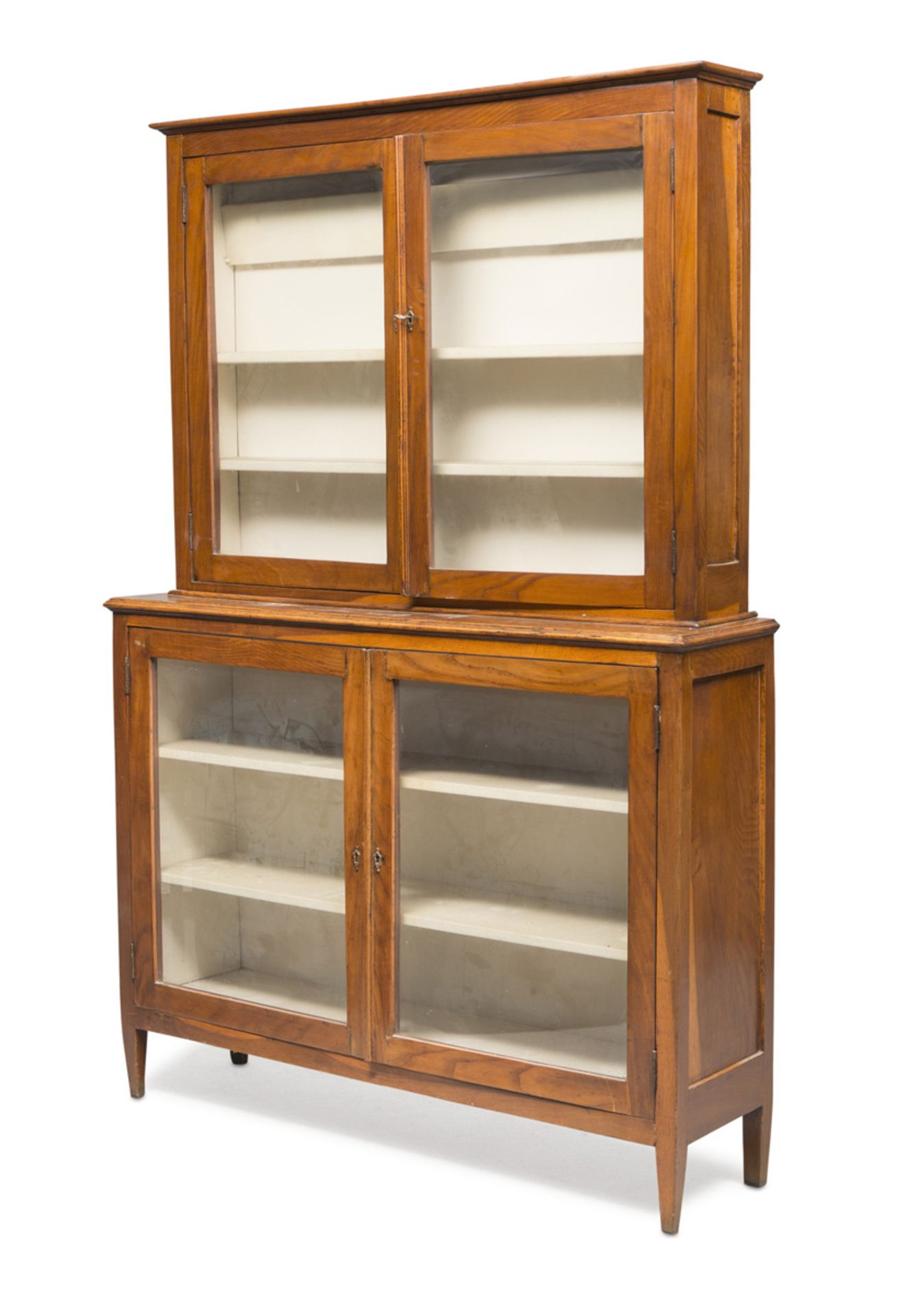 BOOKCASE CABINET IN WALNUT, CENTRAL ITALY EARLY 19TH CENTURY with two glass doors and square tapered