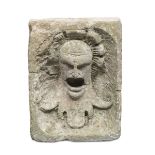 SMALL HIGH-RELIEF SCULPTURE IN PEPERINO, 16TH CENTURY fountain spout sculpted to classical head.