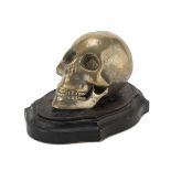 MODEL OF SKULL AND CROSSBONES IN GILDED METAL - LATE 19TH CENTURY