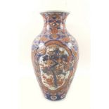 A 19th century Japanese imari vase,shaped foliate reserves containing prunus trees,