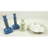 A Graingers Worcester vase on three moulded legs and integral base,