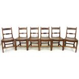A set of six Georgian elm and oak dining chairs, curved rails and single mid rail,