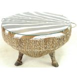 A Zebra hide drum shaped coffee table, late 20th century, with circular glass top,