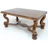 A walnut veneered coffee table,