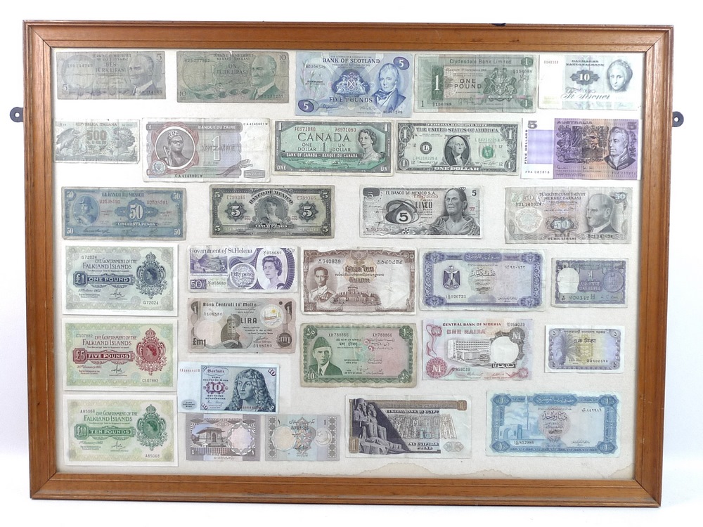 A large collection of post WWII world bank notes, mounted and framed in six frames,