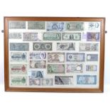 A large collection of post WWII world bank notes, mounted and framed in six frames,