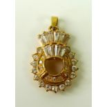 A 22ct gold and white stone pendant in the form of a oval with coronet of baguette cut white stones,