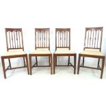 A set of four Edwardian mahogany and inlaid dining chairs, drop in seats with cream fabric,