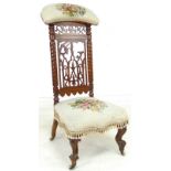 A Victorian mahogany prie dieu chair, with pierced and carved decoration,