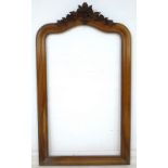 A 19th century French carved and moulded fruitwood frame,