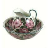 A Wemyss Ware jug and bowl wash set, early 20th century, painted with roses, printed,