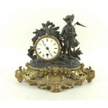 A French late 19th century figural spelter and gilt metal mantel clock,