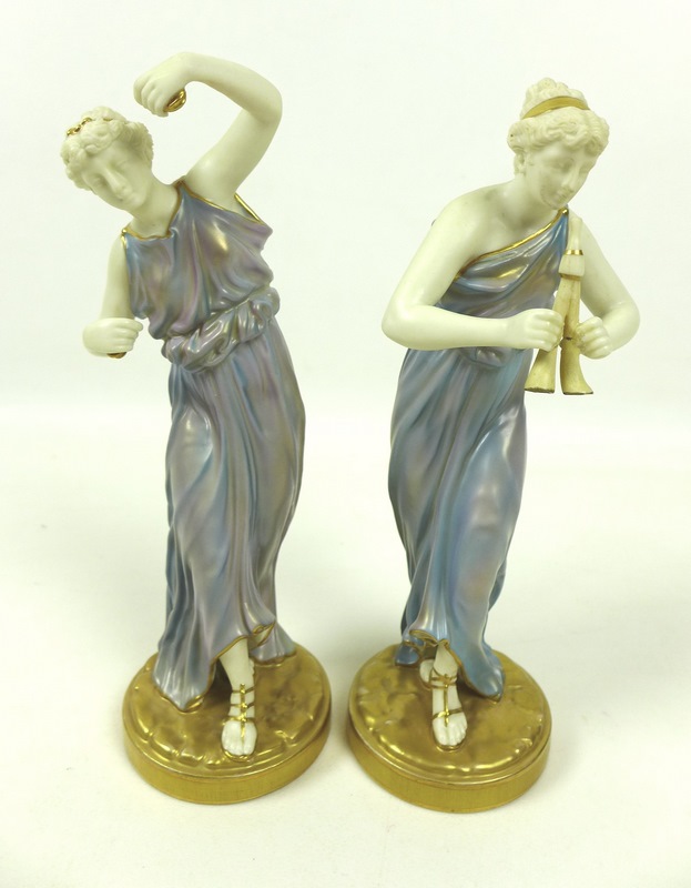 A pair of Royal Worcester porcelain figurines, circa 1928, modelled as music and dance,