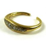 An 18ct gold and diamond seven stone ring, the old cut diamonds in a rub over setting,