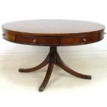 A Regency style drum library table,