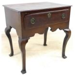 An early Georgian oak lowboy, the rectangular surface with moulded edge and incuse corners,