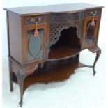 An Edwardian mahogany cabinet, being the base section of a bookcase sideboard,
