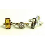 A collection of three dress rings, comprising a Julien MacDonald designer ring of modern design,
