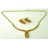 An Indian high grade gold and diamond necklace, and pair of matching earrings,
