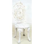 A Victorian white painted Coalbrookdale style cast iron garden chair,