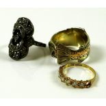 A selection of three rings, comprising a 14ct gold ring in the form of a salmon,