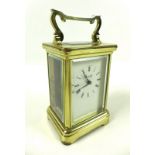 A 20th century carriage clock, of conventional form with glazed brass case,