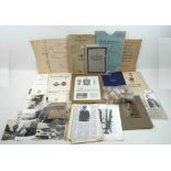 A group of militaria WWI and WWII items and ephemera including a cloth pouch containing a crucifix