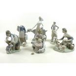 A group of six Lladro figures comprising a girl with a goat, lady with a calf,