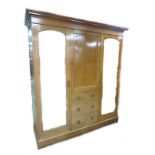 A Maple and Co, London, mahogany and inlaid compactum wardrobe, in three sections,