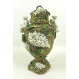 A late 19th century Continental porcelain vase and cover,