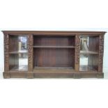 A Victorian mahogany and rosewood veneered bookcase, lower section only,