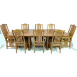 A modern American oak extending dining table, with three additional leaves, each 28.