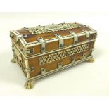 A 19th Century Anglo-Indian Vizagapatam box, the lid and exterior with fretwork panels,