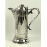 An ecclesiastical silver plated flagon of large proportions, with wide spout,