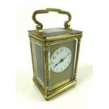 A 20th century carriage clock, brass case with reeded columns flanking the front,
