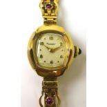 A 9ct gold lady's cocktail watch by Rotary, the crown set with a blue stone cabochon,
