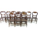 A composite set of twelve Edwardian stained beech balloon back dining chairs, being two sets of six,