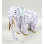 A modern Herend model of an elephant, modelled in standing pose, its hide decorated in a purple