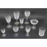 A large collection of Waterford Crystal drinking glasses, including a suite of table glasses