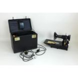 Singer 222K electric sewing machine, complete with original case, keys, foot pedal and cable,