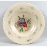 A Clarice Cliff for Wilkinson Ltd charger, decorated with chrysanthemums, spring flowers and