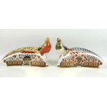 A pair of Royal Crown Derby paperweights, modelled as ‘Golden Pheasant’ and ‘Lady Amherst Pheasant’,