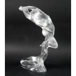 A modern Lalique clear crystal sculpture, modelled as a female nude, 'Arms Up Acrobat', standing