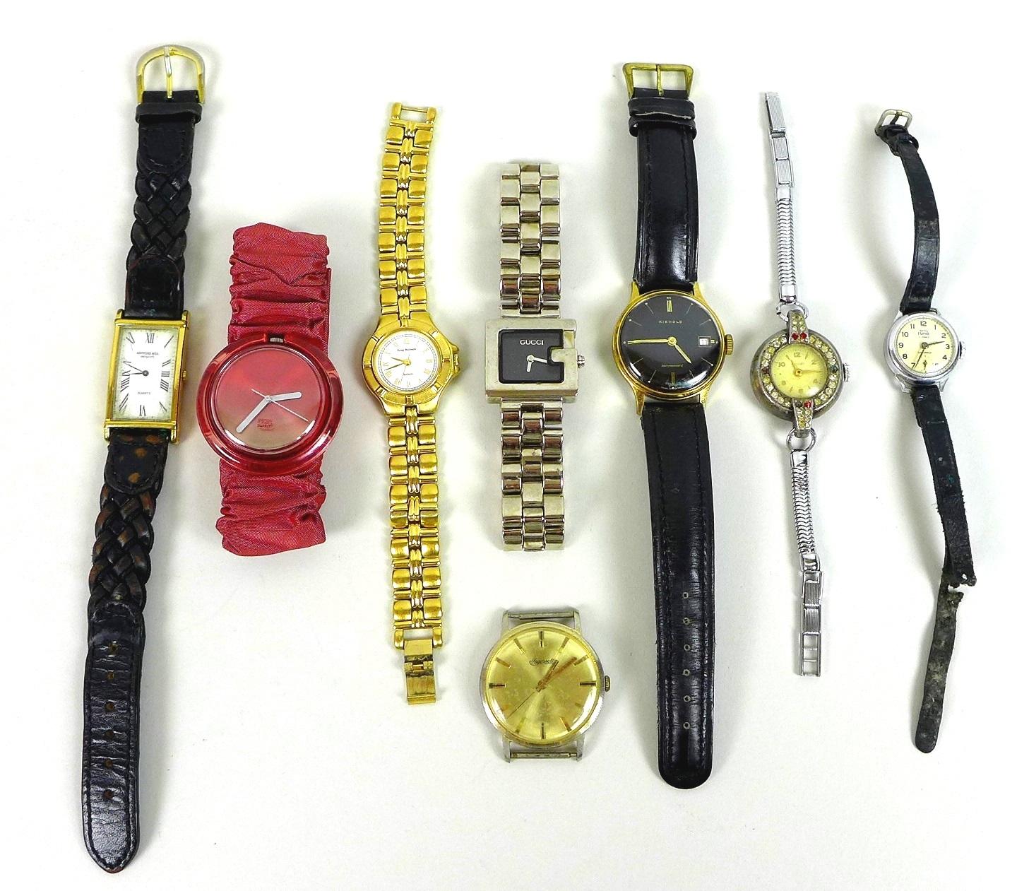 A group of eight watches, including a Raymond Weil rectangular faced watch with Roman numerals, a