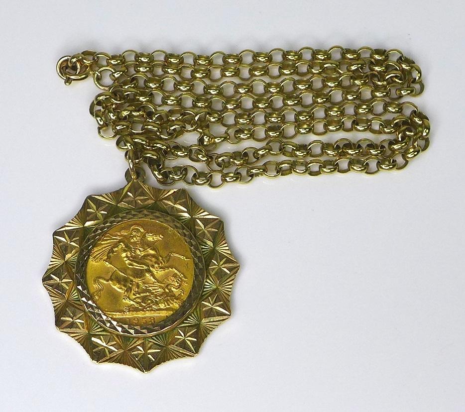 An Elizabeth II gold sovereign, in 9ct gold mount and 9ct gold chain, 33mm across, chain 56cm