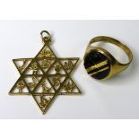 A 9ct gold pendant, of star form decorated with signs of the zodiac, 3.2g, 3.5cm, together with a