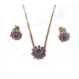 A 9ct rose gold and amethyst necklace and earrings set, of daisy design, 5.1g total. (3)