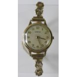 A 9ct gold Vertex lady's wristwatch, circular dial silvered dial with gold Arabic numerals, dial